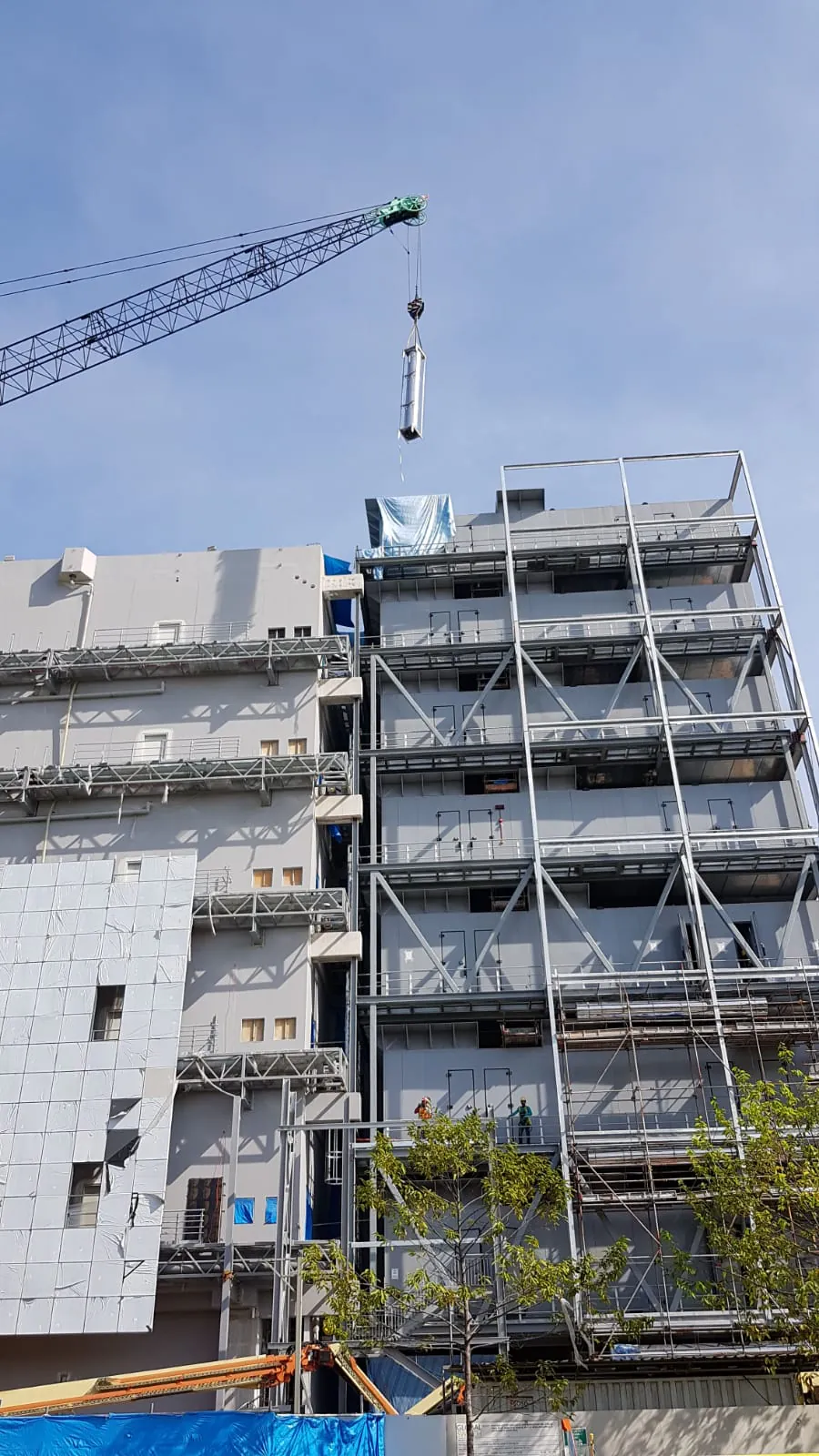 FlexEstack craned into a data centre genset hall — single-lift delivery into a multi-level building.