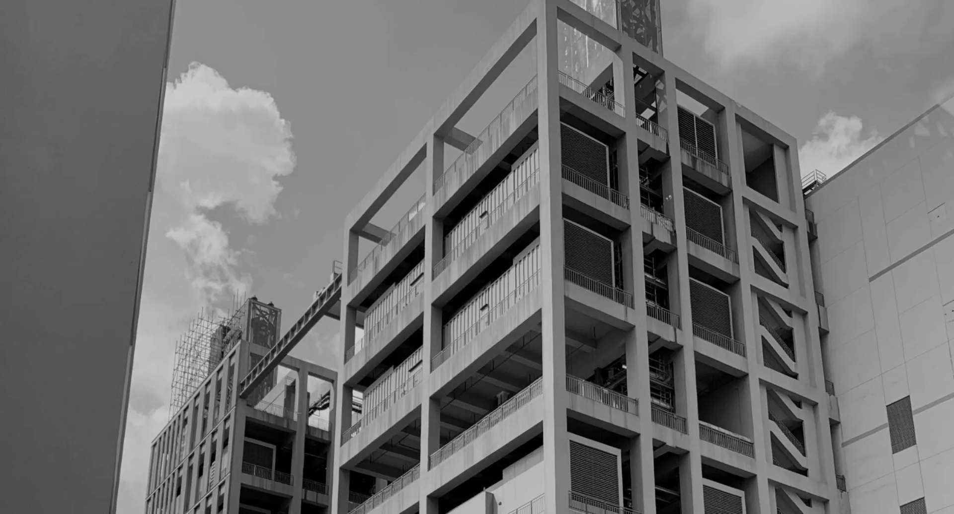 FlexEstack multi-level engineering building — modular stacked enclosures integrated into a permanent facility.